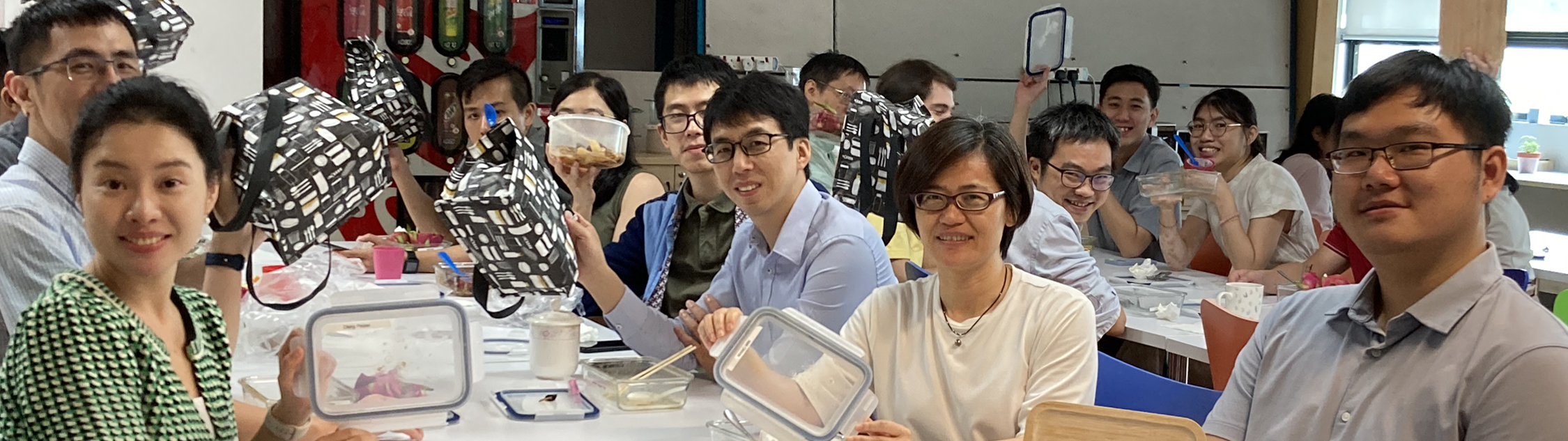 CGG Singapore team showing off new lunchboxes